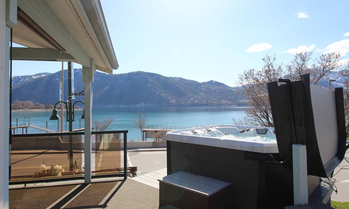 Manson House | Lakeview home with wrap-around deck, easy lake access, private hot tub, & more