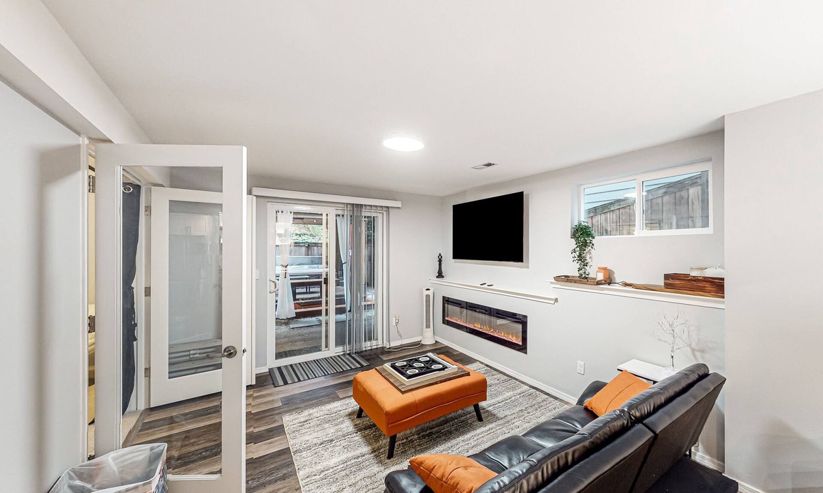 The Wedge House | Modern lower-level getaway with a fireplace, inviting patio & washer/dryer