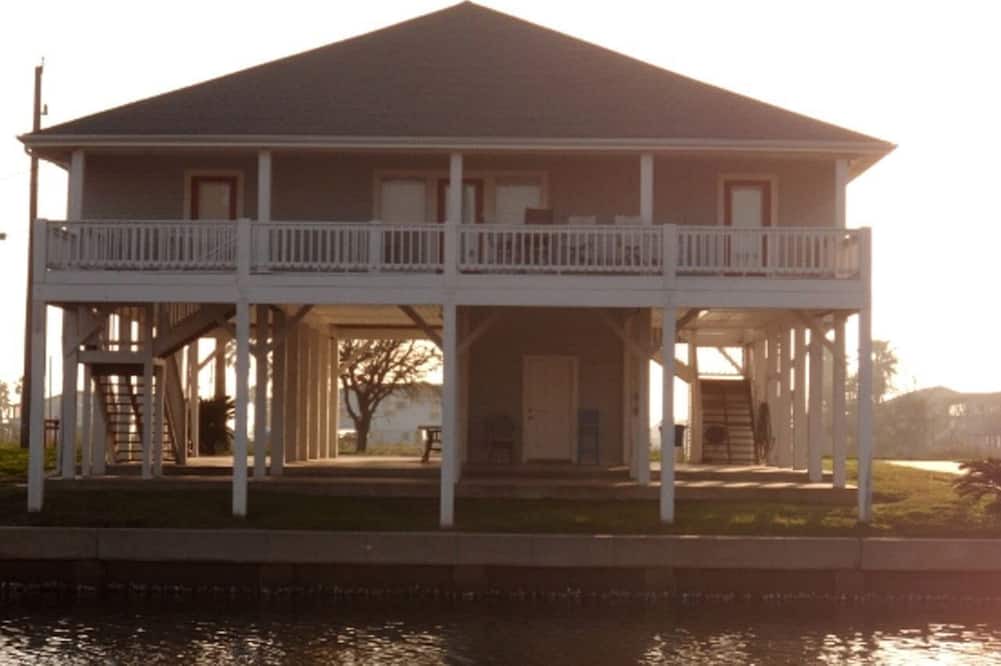 Crystal Beach Cabin | Pet-Friendly Vacation Rental with a Boat Slip on a Canal in Crystal Beach, Texas