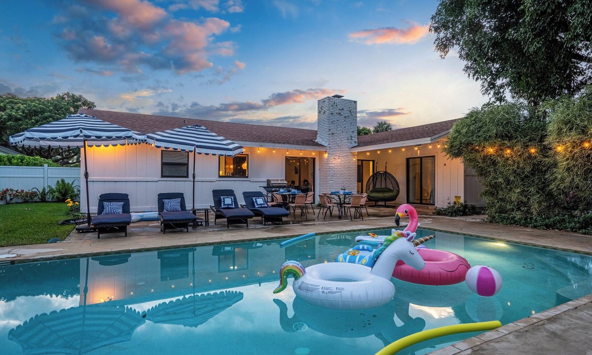 Lake Clarke Shores House | Spacious Palm Beach Paradise with Heated Pool and Backyard Games