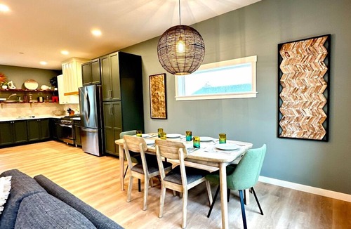 Ocean Shores House | After Dune Delight is a newly built waterfront escape with peaceful canal views—designed for slow mornings, cozy evenings, and effortless coastal living.