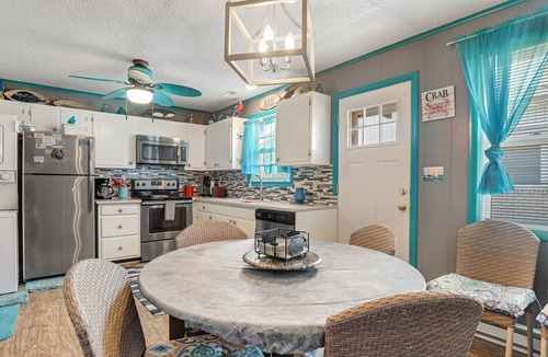 North Ocean City House | Beach-Themed Canal-Front Home w/Private Deck, Dock, Water Views, Free WiFi