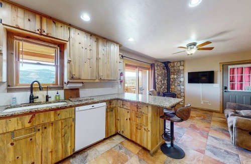 Alpine Village Cabin | Beautiful mountain-view cabin with covered deck, grill, fireplace & washer/dryer