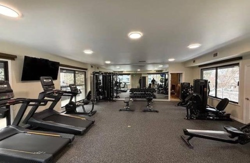 Aspen House | Chateau Eau Claire Unit 22, Condo Overlooking the Roaring Fork River with a Private Deck