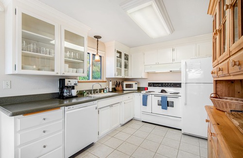 University Place House | Comfortable home with Puget Sound view, decks, garden patio, WiFi & W/D