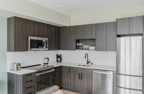 Squire Park Apartment | Delightful First Hill Jr 1BR w/Bike Storage, Gym & W/D, by Blueground