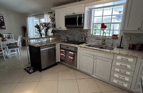 Palm Aire Village West House | Fantastic Lakefront Home With Private Yard and Pool