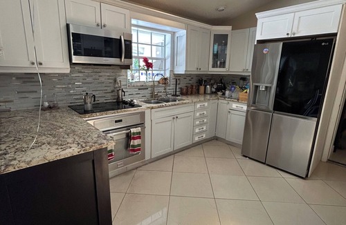 Palm Aire Village West House | Fantastic Lakefront Home With Private Yard and Pool
