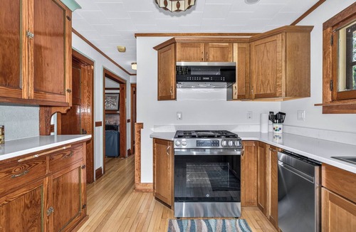 St Germain House | Gorgeous lakefront cabin, wrap-around enclosed porch, dock!