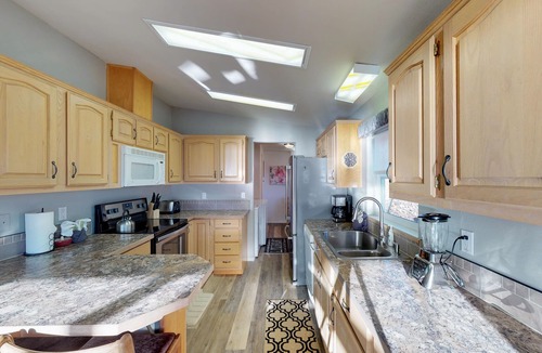 Manson House | Lakeview home with wrap-around deck, easy lake access, private hot tub, & more