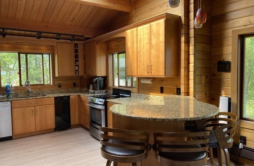 Sand Lake House | Large luxurious lakefront home with water toys & mountain view