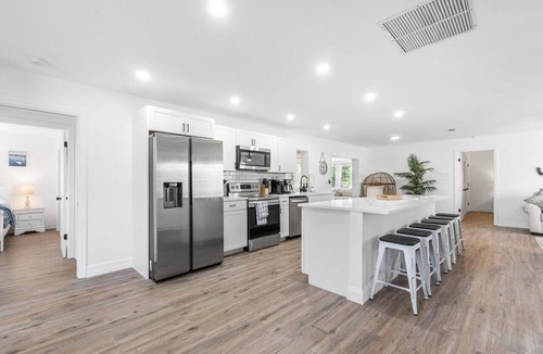 West Palm Beach House | Luxury Coastal Oasis with Heated Pool and 4BR Family Retreat Near Beaches