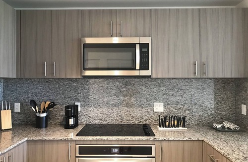Doral Condo | Modern building, centrally-located condo,2 bedrooms/2 bathrooms, parking space.