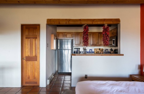 Arroyo Seco Apartment | Queen adobe studio with full kitchen, in-unit washer/dryer & fireplace. Private balcony + valley views. 15 min to Taos Ski Valley · 5 to Arroyo Seco. Sleeps 2.