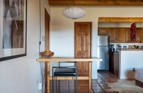 Arroyo Seco Apartment | Queen adobe studio with full kitchen, in-unit washer/dryer & fireplace. Private balcony + valley views. 15 min to Taos Ski Valley · 5 to Arroyo Seco. Sleeps 2.