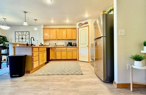 Olympia House | Spacious modern family home with open living, full kitchen, office nook, and private access