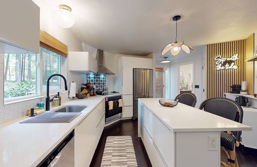 Burley House | Unique waterfront home with sauna, hot tub, and washer & dryer