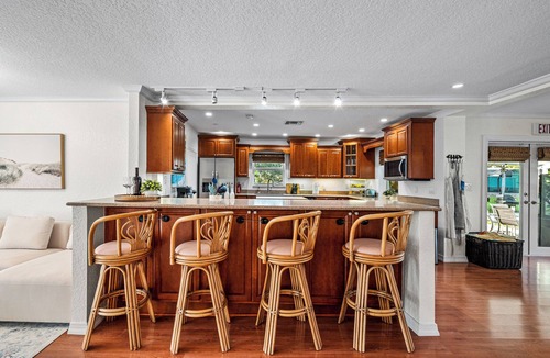Lake Clarke Shores House | Waterfront Escape with Heated Pool, Mini-Golf, TikiHut in West Palm Beach