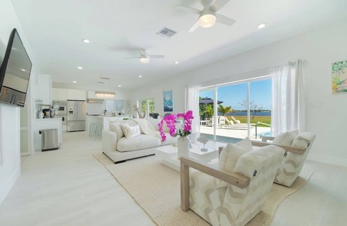 West Palm Beach House | Waterfront Sanctuary, Heated Pool, Parking, Sauna