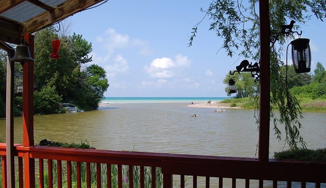 Cozy rustic cottage on Nine miles river, viw of Huron Lake sunset. Pet friendly in Goderich