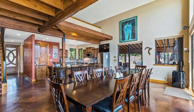 Custom riverfront home with private dock, game room, hot tub & heated floors