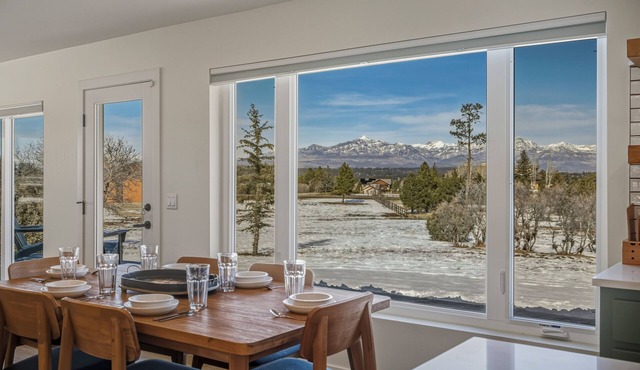 Expansive home that sleeps up to 7 on 5 acres with stunning mountain views, chef's kitchen, hot tub, entertainment room, 2 car garage, and 2 Fireplaces.