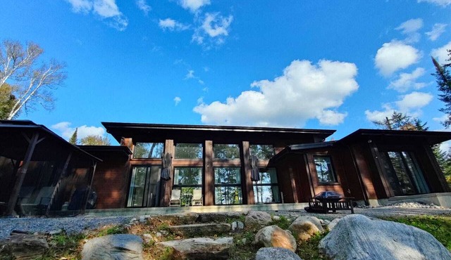 Expansive Lakefront modern retreat nestled by nature, huge windows ,4 bedroom in Nominingue