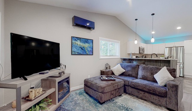 Inviting riverfront home with full kitchen, firepit, W/D, & dog-friendly