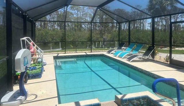 Outdoor paradise on waterway with pool and spa, beach gear, and dog friendly