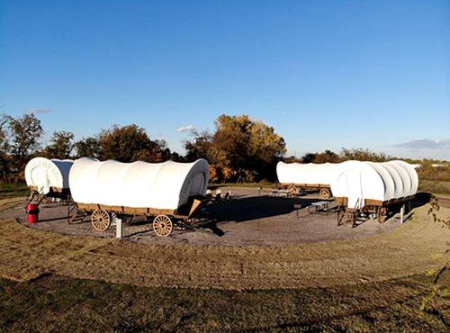 Perfect Glamping Vacations in this Rustic Conestoga Covered Wagon Rental in Oklahoma